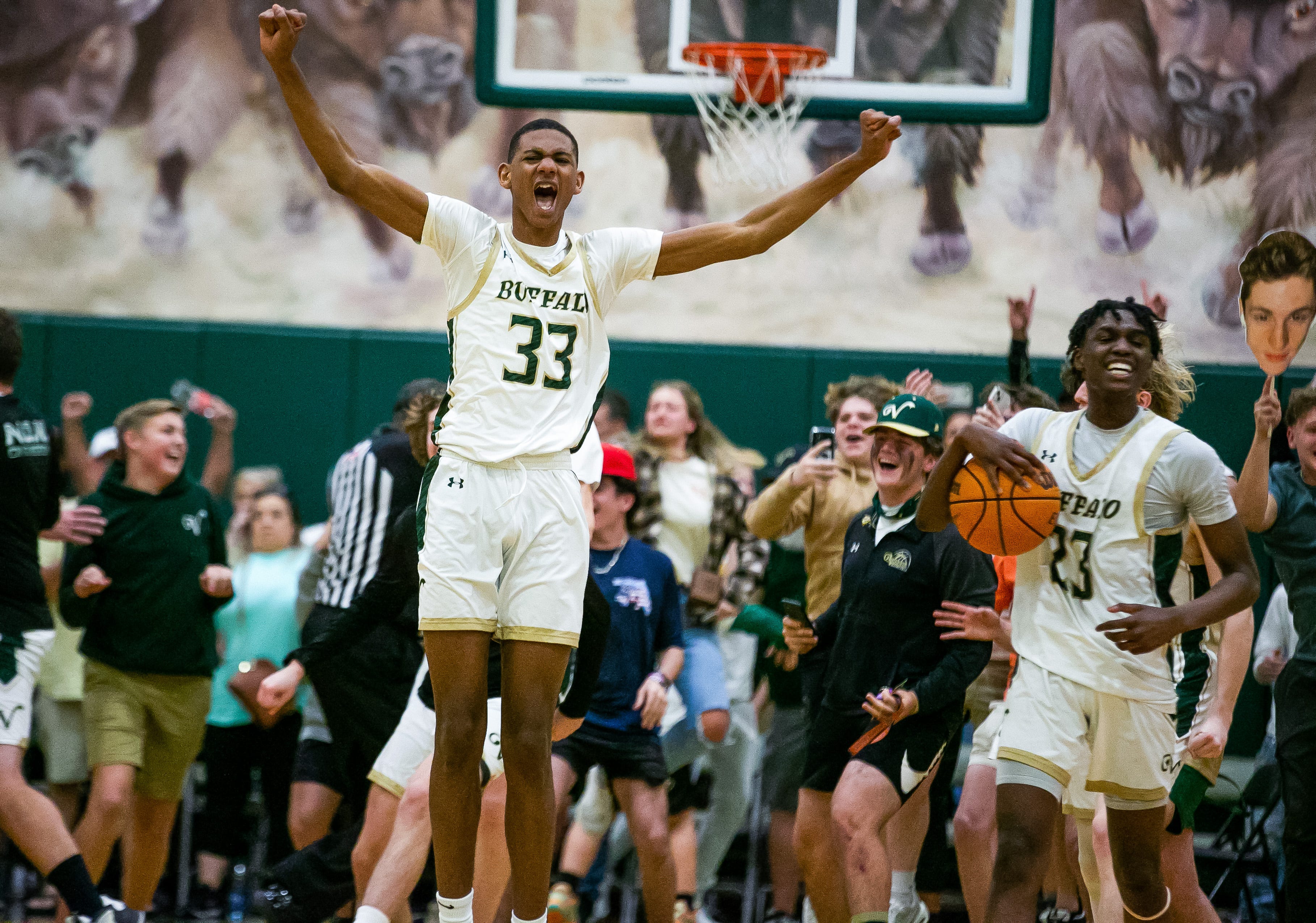 Villages forward Christopher Washington Jr. (33) celebrates after defeating North Marion.